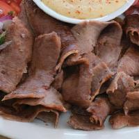 # 7 Beef Shawarma · Slow roasted & thinly shaved marinated Black Angus beef with our house spices, hummus, tahin...