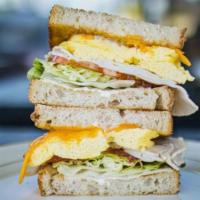 Protein · Turkey, eggs, cheddar cheese, mayo, lettuce, tomatoes on rustic sourdough.