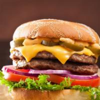 Caliente Spicy Burger · Juicy Angus beef patty with Cajun seasoning, melted pepper Jack cheese, sautéed onions, gril...