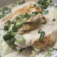 Tom Kha · Lemongrass, lime, and coconut milk based soup with cabbage, mushroom, cilantro, and green on...