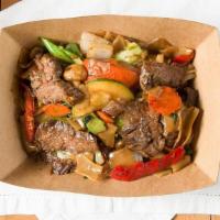 Drunken Noodles · Thin rice noodle stir fried with a soy sauce blend, basil, red, and green bell peppers, cabb...