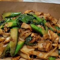 Pad See Ew · Wide rice noodles stir fried with a soy sauce blend, garlic, eggs and Chinese broccoli.