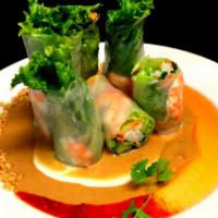 Fresh Spring Rolls · rice paper wrapped w/ mixed green, carrot,  cucumber & basil with peanut sauce.