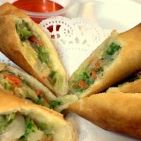 Egg Rolls · fried rolls stuffed with cabbage, celery, carrot & glass noodle served with sweet & sour sau...