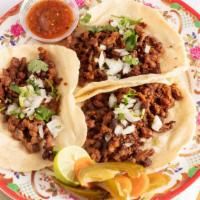 Taco (Regular) · Taco made with corn tortilla and includes choice of meat, onion, cilantro, and sauce.