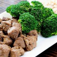 Vegan Steak Muscle Meal · meatless vegan steak served with two free sides