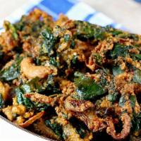 Spinach Pakora · Spinach coated with chickpea batter and fried.