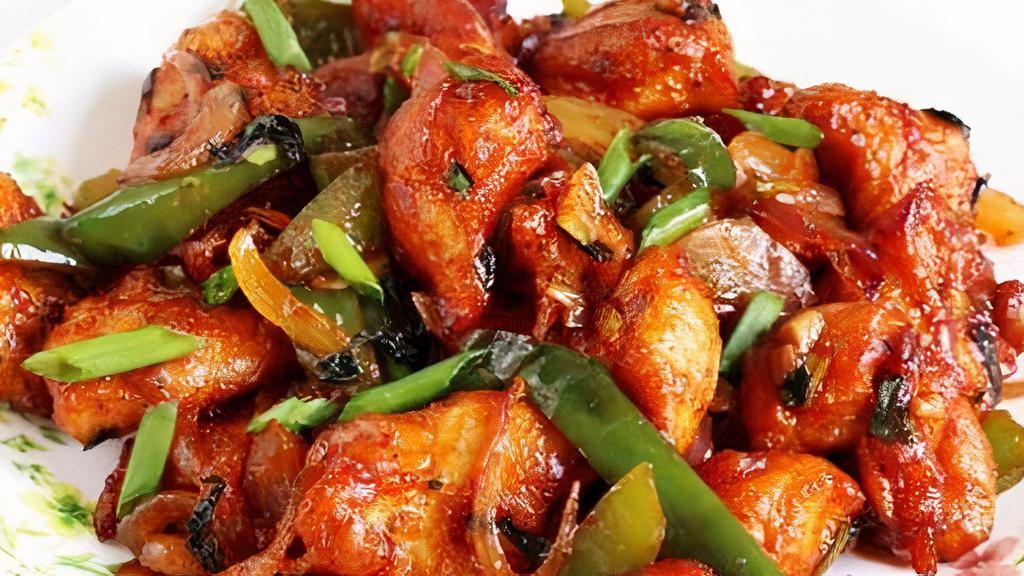 Chilli Chicken · Diced boneless chicken sautéed with hot chili sauce and green peppers.