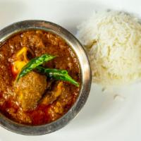 Goat Curry · Goat curry is basically small cuts of goat slow-cooked in a gravy made with onions, tomatoes...