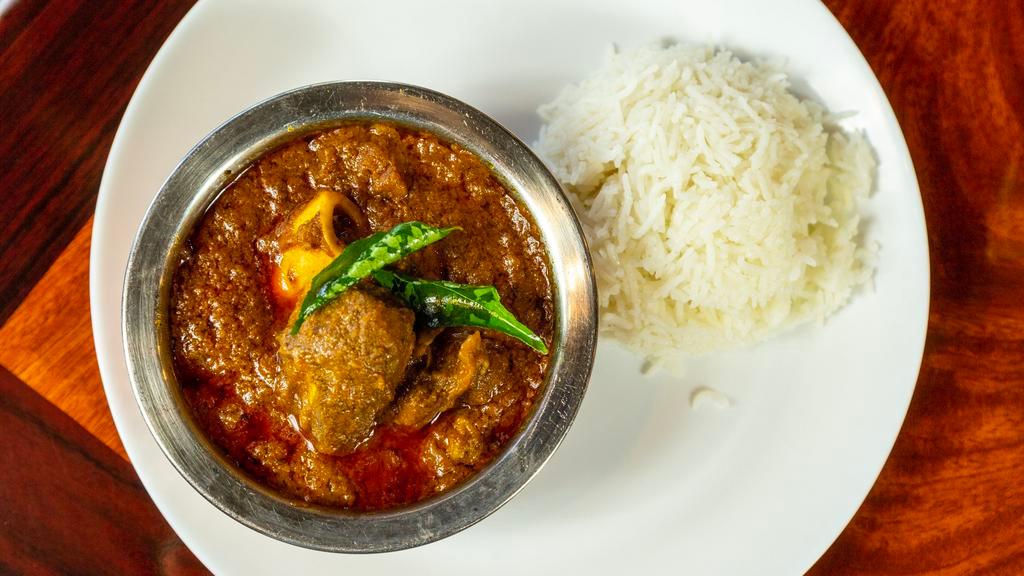 Goat Curry · Goat curry is basically small cuts of goat slow-cooked in a gravy made with onions, tomatoes, garlic, and aromatic spices.