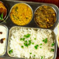 Chicken Lunch Special · One main Curry of the day 
Two side Dishes 
Rice, Naan and Dessert.