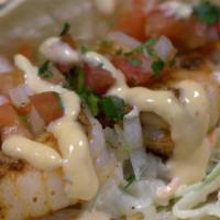 Shrimp · Housemade-slaw, pico de gallo and chipotle aioli sauce on a soft corn tortilla.
