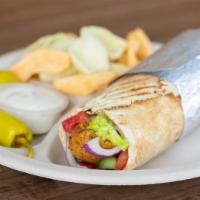 *Falafel Wrap · 3 falafels wrapped in a warm pita with tomatoes, cucumbers, red onions, chopped parsley, let...