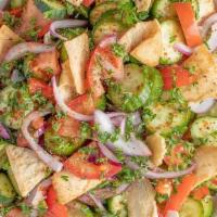 *Fattoush Salad · Chopped cucumbers, tomatoes, red onions, parsley, mint, paprika, crispy pita chips, served w...