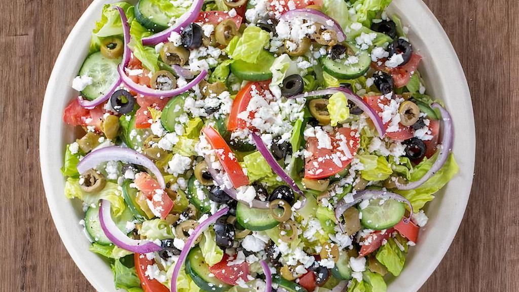 *Greek Salad · Kalamata olives, tomatoes, cucumbers, red onions, cubed feta cheese, romaine lettuce, served with a side of our greek dressing and freshly sliced lemon wedge.