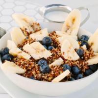 Organic Quinoa Bowl · Organic red & white quinoa, fresh blueberries, bananas and cinnamon. Topped with candied wal...