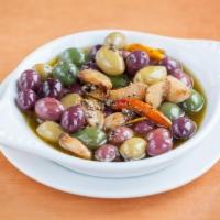 Marinated Olives · Castelvetrano olives, Picholin olives & Gaeta olives marinated in black peppercorn, rosemary...
