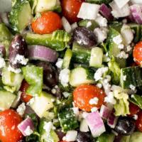 Greek Salad · Lettuce, tomatoes, black olives, onions, and feta cheese, topped with oil and vinegar.