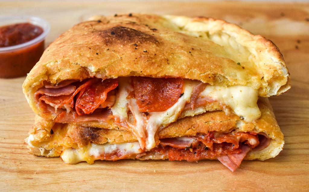 Calzone · Pocket filled with marinara sauce, mozzarella cheese, and ricotta cheese, plus your choice of fillings.