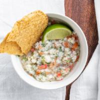 Ceviche De Pescado · Marinated fish ceviche with avocado and tostadas