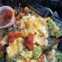 Lite N Fluffy Scramble · Egg whites with turkey bacon, spinach, tomatoes, broccoli on top of country potatoes & chedd...