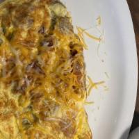 Supreme Omelette · Sausage, bacon, peppers, mushrooms, & tomatoes, loaded with swiss cheese. Served with your c...