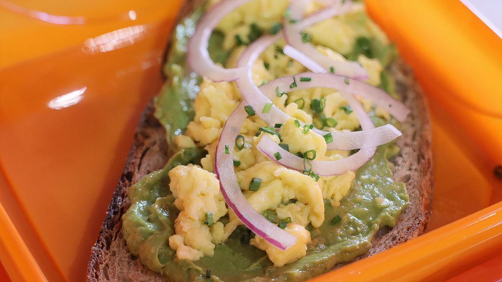 Avocado Toast · Homemade avocado spread on our country loaf bread, with scrambled organic eggs and red onion. No green side.