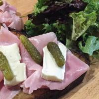 Parisian Brie Tartine · Traditional cooked ham, Brie cheese, lettuce, and cornichons.