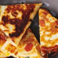 Quesadilla · Tortilla filled with delicious cheese and your choice of meat fresh to order.