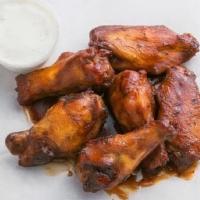 Barbecue Wings · Chicken wings on the bone, tossed in a traditional flavorful barbecue sauce, and served with...