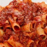 Spaghetti With Meat Sauce · Spaghetti served with our homemade meat sauce in our homemade marinara sauce. Served with a ...