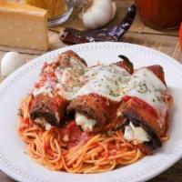 Eggplant Parmigiana With Spaghetti · Served with a side of focaccia bread. Breaded eggplant fried with marinara sauce and oven ba...