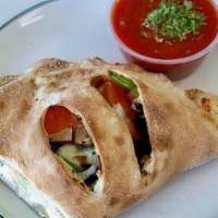 Vegetarian Calzone · Ricotta cheese and mozzarella cheese, sliced tomatoes, black olives, mushrooms, green pepper...