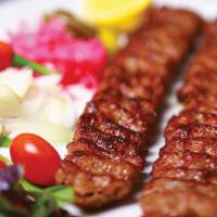 Koobideh Kebab · A double skewer of ground beef kebab.