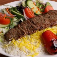 Soltani Kebab · 2 skewers of beef kebab and ground beef served over white rice with saffron.