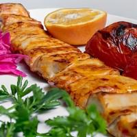 Soltani Chicken Kebab · 2 skewers of chicken kebab and ground chicken meat kebab served over white rice with saffron.