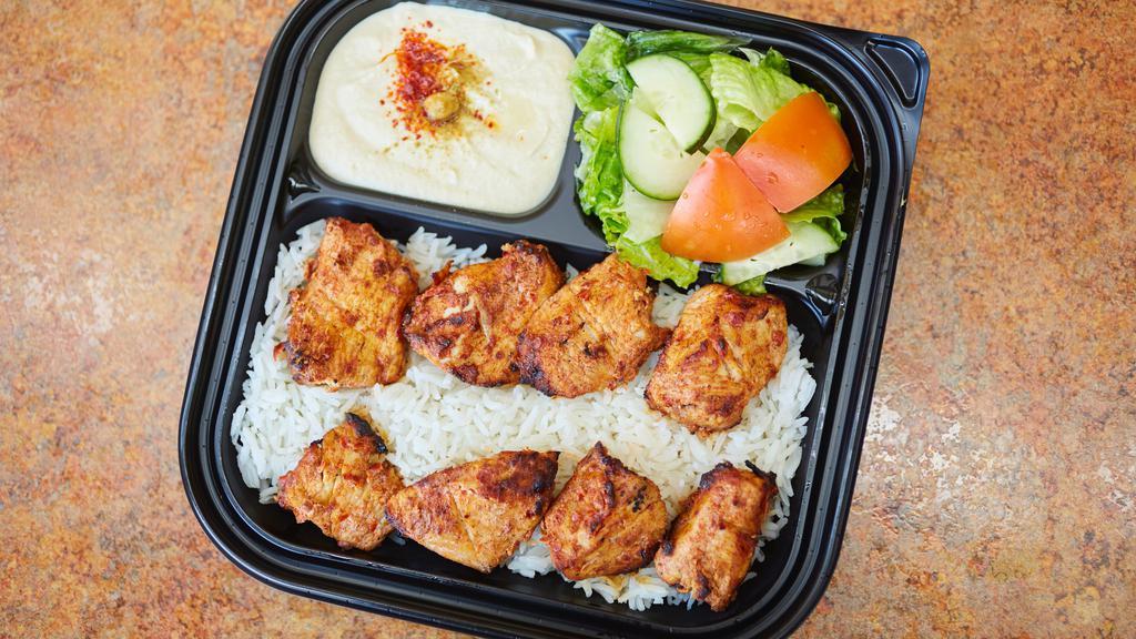 Chicken Kabob Plate · Marinated chicken breast pieces grilled on skewers with garlic sauce.