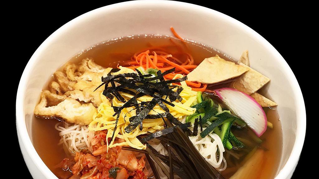 Janchi Noodle Soup / 잔치국수 · Noodles with vegetables, egg. Seaweed and fish cake in a bowl of soup.