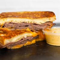 Roast Beef & Cheese Monte Cristo · Smoked ham, Cheddar, Swiss, and Parmesan cheeses melted between egg dipped, griddled sourdou...