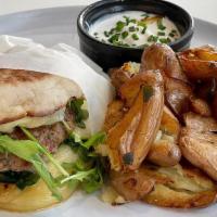 Breakfast Banger · English muffin, house-made breakfast sausage, white cheddar, and fried egg