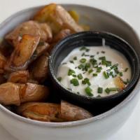 Dirty Potatoes · Steamed & deep fried fingerling potatoes, garlic confit, sage, crème fraiche, chives.

Consu...