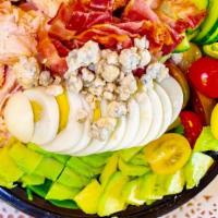 Cali Cobb Salad · Mixed greens with chicken, bacon, avocado, tomato, cucumber, hard boiled egg, blue cheese cr...