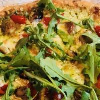 The Green Pizza · Favorite. Basil pesto, mozzarella, roasted red pepper, roasted garlic and finished with arug...