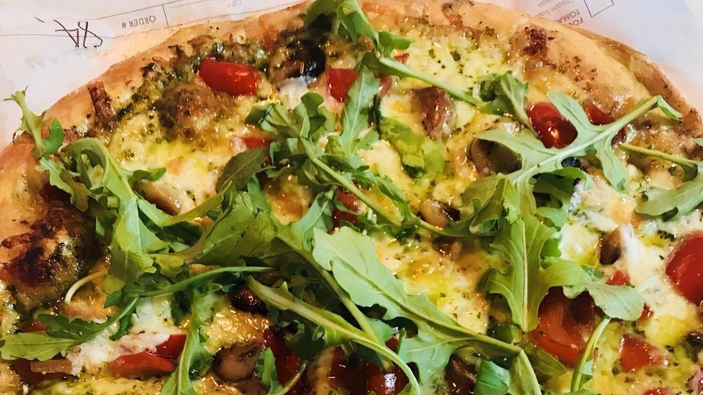 The Green Pizza · Favorite. Basil pesto, mozzarella, roasted red pepper, roasted garlic and finished with arugula.