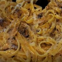 Fettuccine Alfredo · Fettuccine pasta with Alfredo sauce, with touch of garlic and mushroom.