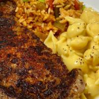Smothered Steak Plate · Ribeye Steak seared in Creole spices, smothered with onions and brown gravy plus choice of t...
