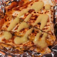 Asada Quesadilla · Chargrilled ranchera, shredded melted cheese in a crispy flour tortilla, and served with a s...