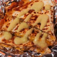 Al Pastor Quesadilla · Chargrilled, al pastor, shredded melted cheese in a crispy flour tortilla and served with a ...