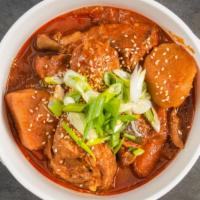 Spicy Korean Chicken Stew · Dakbokkeumtang. Drumsticks in a spicy red sauce along with potatoes, carrots, and onions. Se...