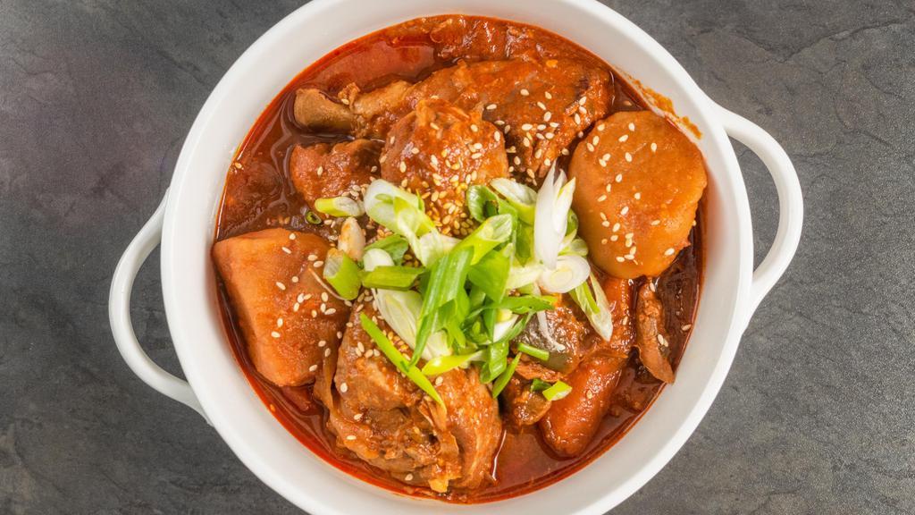 Spicy Korean Chicken Stew · Dakbokkeumtang. Drumsticks in a spicy red sauce along with potatoes, carrots, and onions. Served with rice.